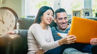 Couple watching laptop